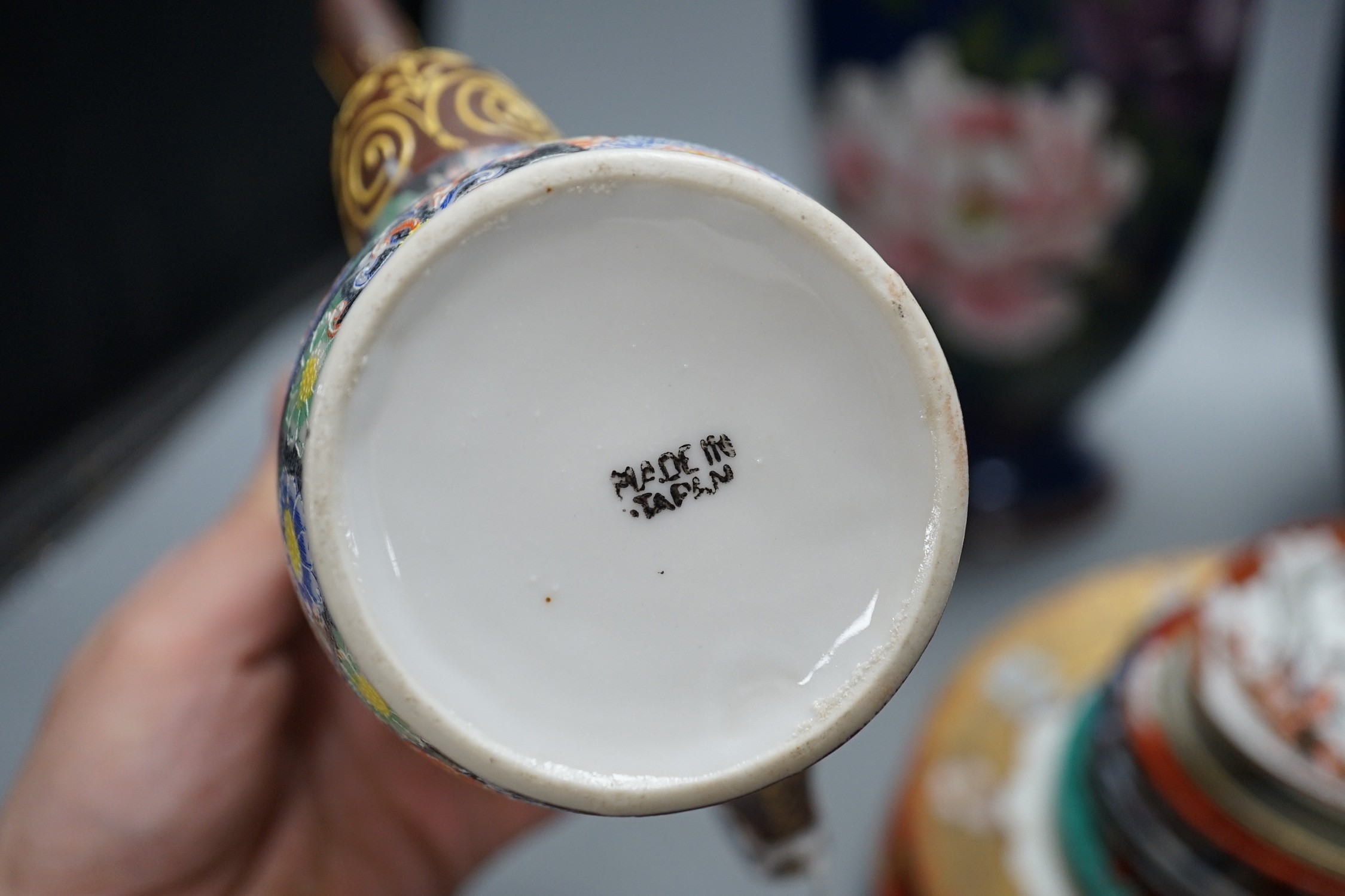 A mixed group of Japanese cloisonné enamel vases and porcelain vases and plates